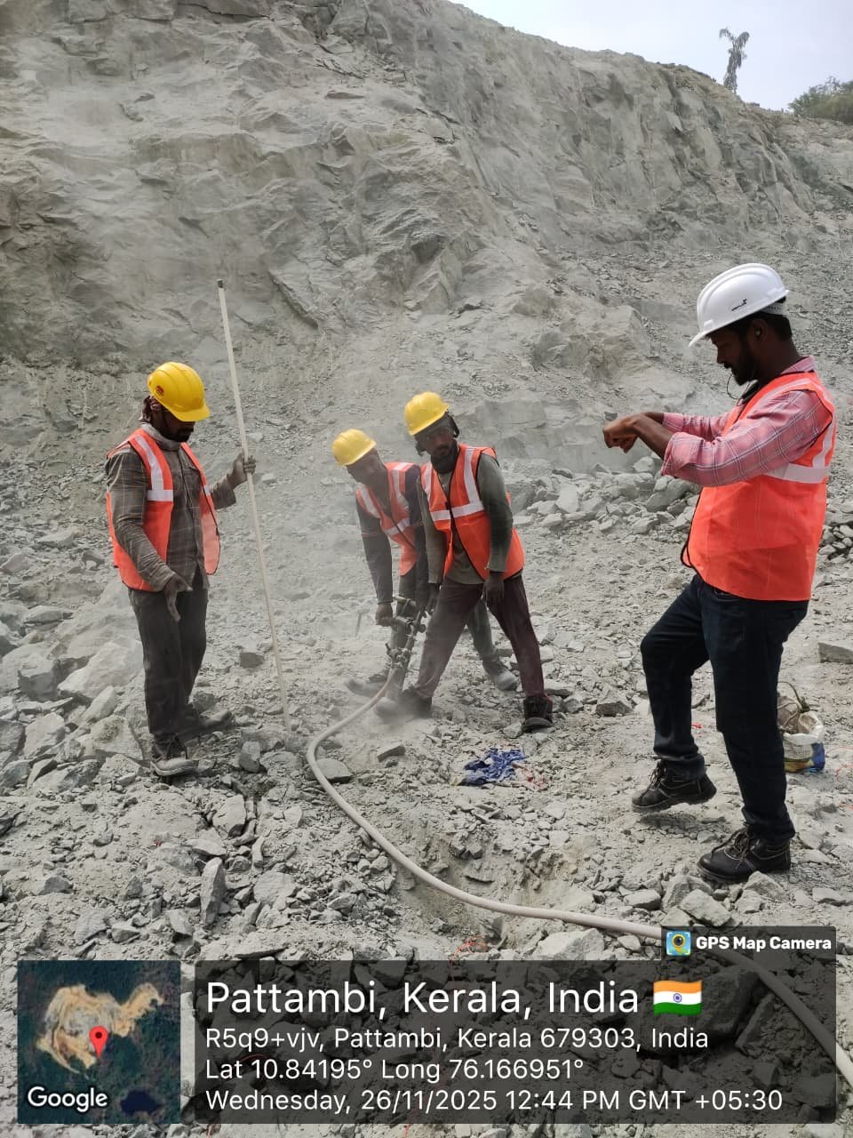 Pneumatic rock drilling operations at granite quarry face